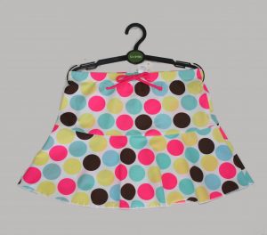 Girls polka dot swim shorts with pink, blue, yellow and black spots 